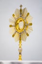 Golden Ostensory or Monstrance for worship at a Catholic church ceremony in detailed view. Royalty Free Stock Photo