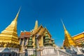 Golden pagoda with giant statue at Royal grand palace temple Royalty Free Stock Photo