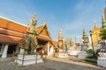 Golden pagoda with giant statue at Royal grand palace temple Royalty Free Stock Photo