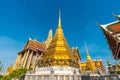 Golden pagoda with giant statue at Royal grand palace temple Royalty Free Stock Photo