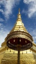 Golden Pagoda and golden ambrella in Thailand WatPradhatchohar Royalty Free Stock Photo