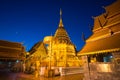 Golden pagoda holy temple at twilight.