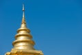 Golden pagoda in Thailand and blue sky