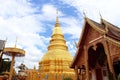 Golden pagoda in Wat Phra That Haripunchai in Thailand.