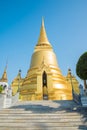 The golden pagoda in Wat Pra Kaew, The Grand Palace, blue sky, T Royalty Free Stock Photo