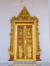 Golden painted door frame of the temple in Thailand. Royalty Free Stock Photo