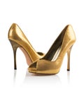 Golden Pair of women shoes Royalty Free Stock Photo