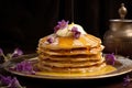 golden pancakes with butter melting on top