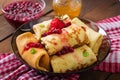 Golden pancakes with cranberry jam Royalty Free Stock Photo