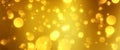 Golden particles shining stars dust bokeh glitter awards dust abstract background. Futuristic glittering in space on gold color ba Royalty Free Stock Photo