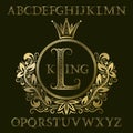 Golden patterned letters and initial monogram in coat of arms form with crown. Royal font and elements kit for logo design