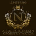 Golden patterned letters and numbers with initial monogram in coat of arms form. Elegant font and elements kit for logo design Royalty Free Stock Photo