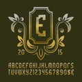 Golden patterned monogram template in beautiful wreath frame with vintage alphabet with numbers