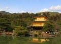 Golden pavilion or castle and lake foreground with copy space. This place call Kinkakuji Temple, Kyoto Japan. Royalty Free Stock Photo