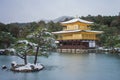 Golden Pavilion of Kinkaku-ji Temple covered with white snow in winter seasonal at Japan.