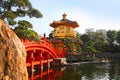 The Golden pavilion and red bridge at sunrise, in Nan Lian Garden near Chi Lin Nunnery, famous landmarks in Hong Kong