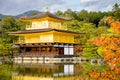 Golden Pavilion with reflections on water in red maple leave, au Royalty Free Stock Photo