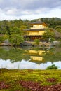 Golden Pavilion with reflections on water in red maple leave, au Royalty Free Stock Photo