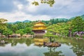 Golden Pavilion Temple in Kyoto, Japan against gloomy sky