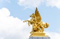 Golden pegasus statue at the Pont Alexander III bridge, Paris, a deck arch bridge that spans the Seine in Paris, France