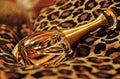 Golden perfume bottle animal print cushion Royalty Free Stock Photo