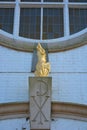 Golden phoenix stone statue detail on a reconverted Christian Church