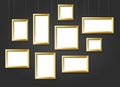 Golden Photo Picture Frames on Black Wall Royalty Free Stock Photo