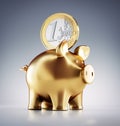 Golden piggy bank with Euro