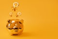 Golden piggy bank on yellow background with Golden Ruble Sign Balloons. Russian currency symbol made of foil balloon. Investment Royalty Free Stock Photo