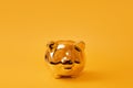 Golden piggy bank on yellow background. Golden money box. Money pig, money saving, moneybox, finance and investments concept. Free Royalty Free Stock Photo