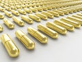 Golden pills Royalty Free Stock Photo