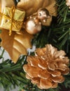 Golden pine cone on christmas tree