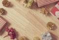 Golden pine cones glittered christmas and gift box decoration on wood table background. copy space Royalty Free Stock Photo