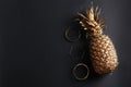 Golden pineapple and bracelets Royalty Free Stock Photo