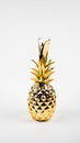 golden pineapple on a white background. copy space Royalty Free Stock Photo