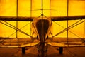 Golden Piper tri-pacer airplane in a hanger Royalty Free Stock Photo