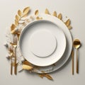 golden place setting with a white plate silverware and gold cutlery Royalty Free Stock Photo