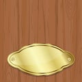 Golden plate over wood Royalty Free Stock Photo