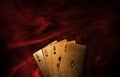 Golden playing cards with red smoke