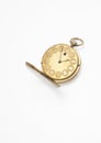 Golden pocket watch over white background Royalty Free Stock Photo