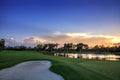 Golden pond at sunset at a golf course on a tropical island Royalty Free Stock Photo