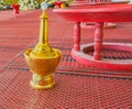 golden pour water containers for Buddhist ceremony.