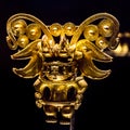 Golden Pre-Columbian figure displayed at the Gold Museum Bogota Colombia