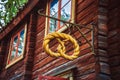 Golden pretzel outside a baker shop. Old bakery sign on a street of Stockholm, Sweden. View on beautiful old store sign with woode