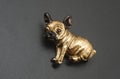Golden pug dog brooch isolated on black Royalty Free Stock Photo