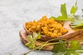 Golden raisins or sultana in bowl on stone background. Dried fruit, healthy snack food