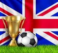 Golden realistic winner trophy cup and soccer ball isolated on national United Kingdom flag. National team is the winner Royalty Free Stock Photo