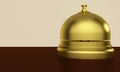 Golden reception bell on a table in a hotel. 3d rendering Royalty Free Stock Photo