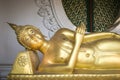 Golden reclining Buddha statue in buddhist temple in Thailand Royalty Free Stock Photo