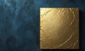 golden rectangular object with textured surface is displayed against dark blue background, creating striking
